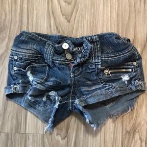 Good condition, dark denim short shorts. Size 0.